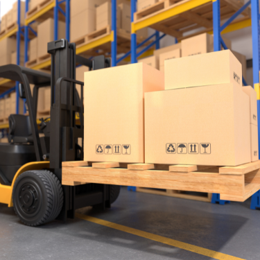 boxes stacked on pallet with forklift in background