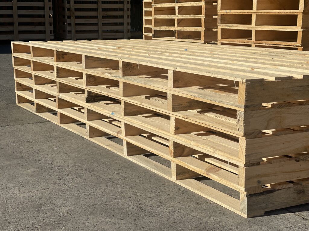 wood pallets and wooden pallets stacked in background