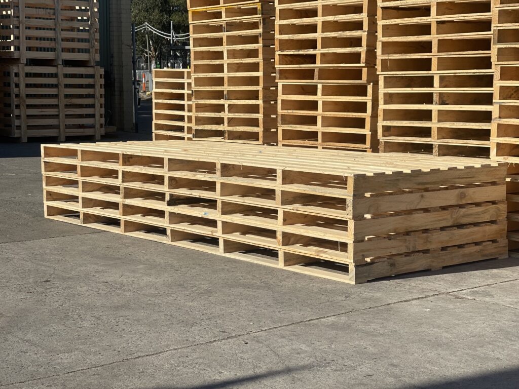 wood pallets and wooden pallets stacked in background